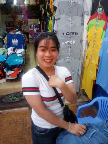 Smiling market trader concealing her band Chau Doc